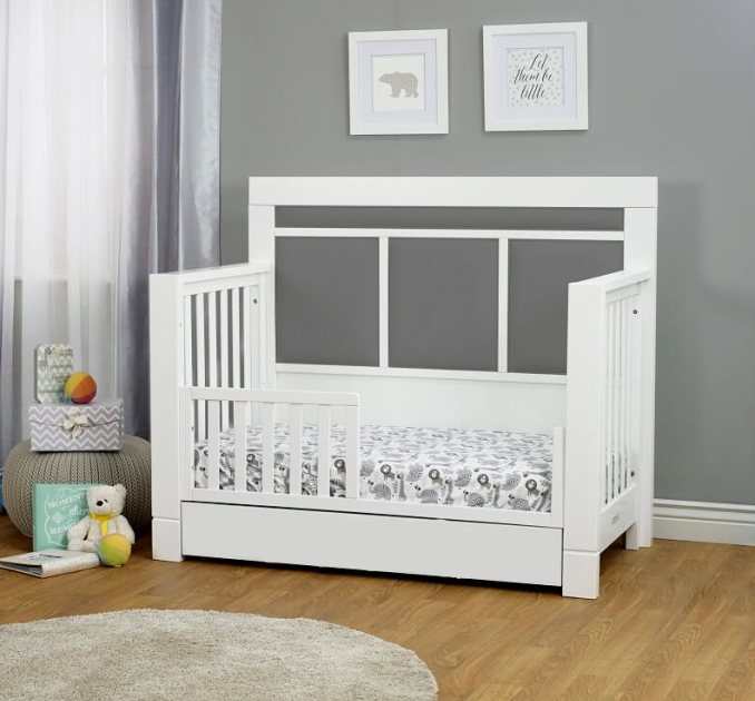 Converts into a toddler bed with guard rail